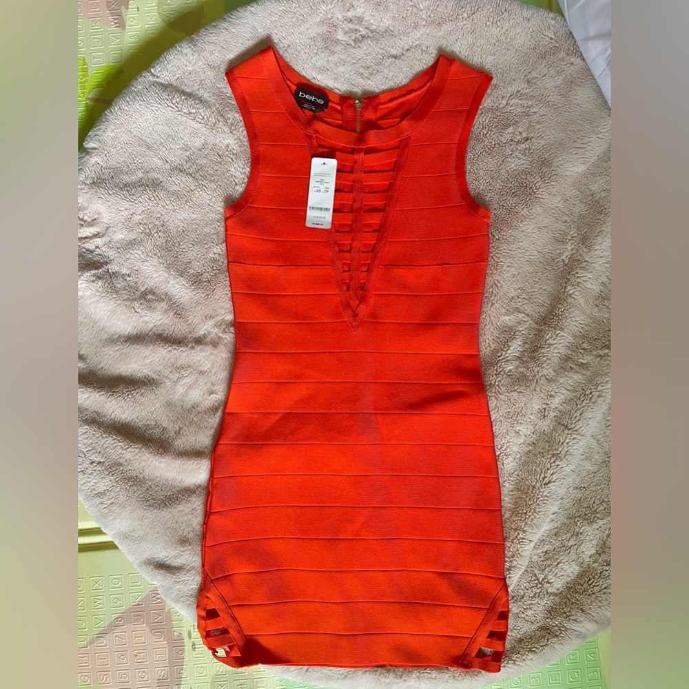 NWT Bebe trendy Orange dress with cutouts